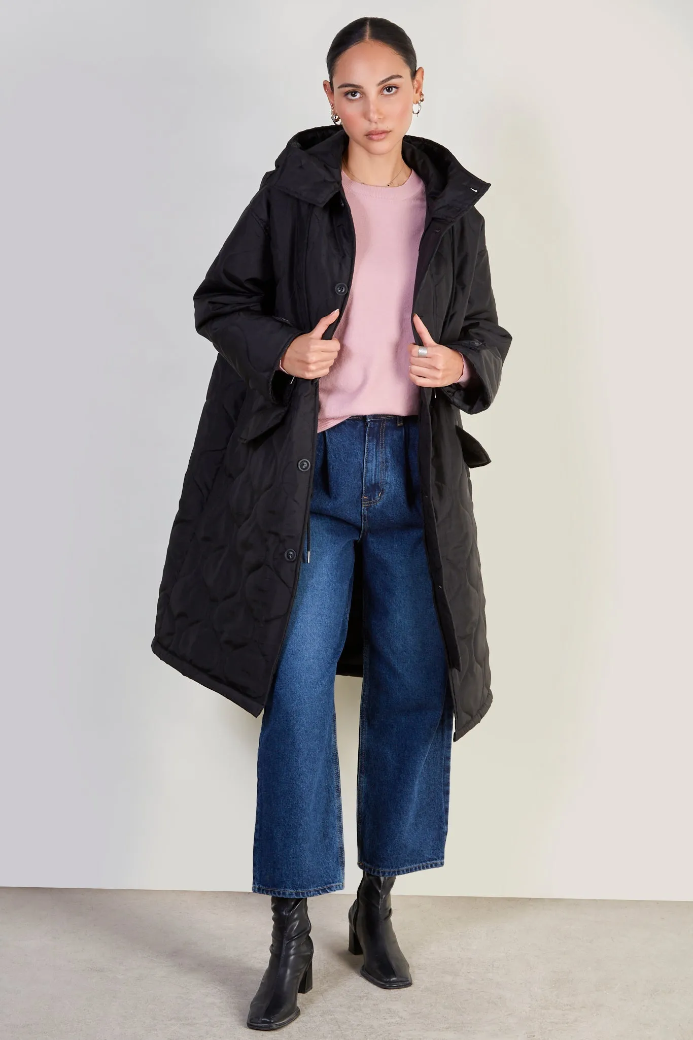 Black long rounded quilt jacket