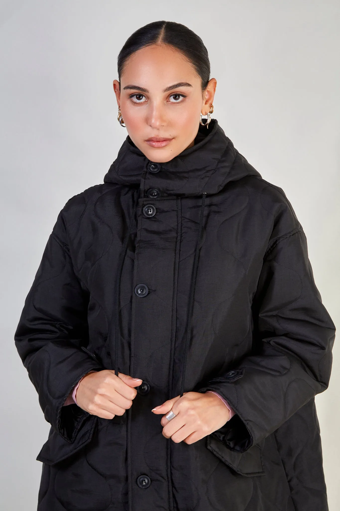 Black long rounded quilt jacket