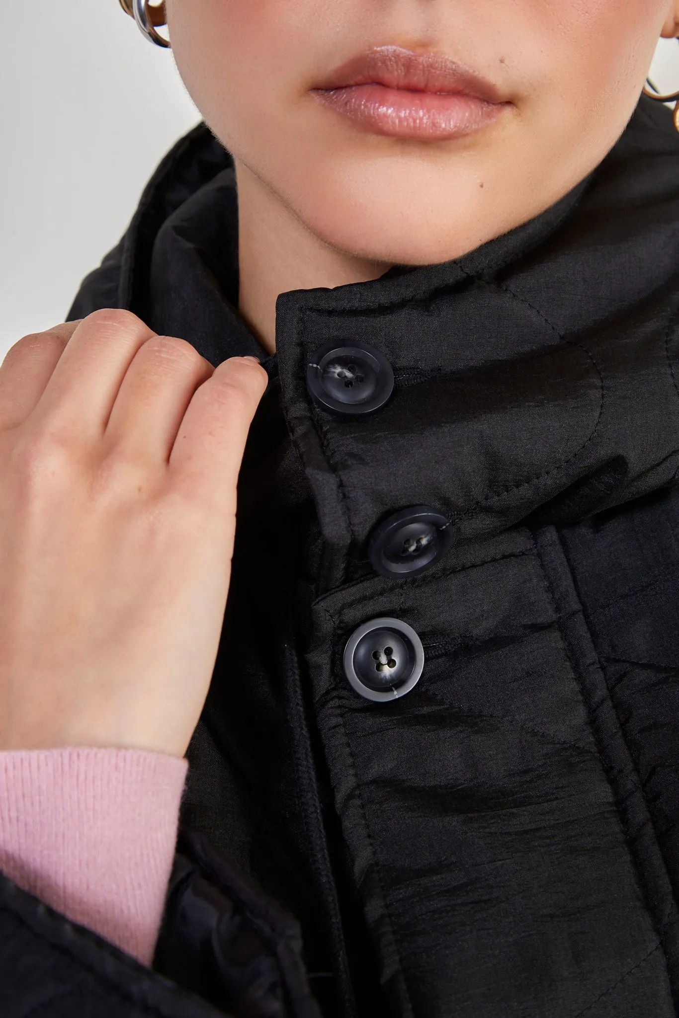 Black long rounded quilt jacket