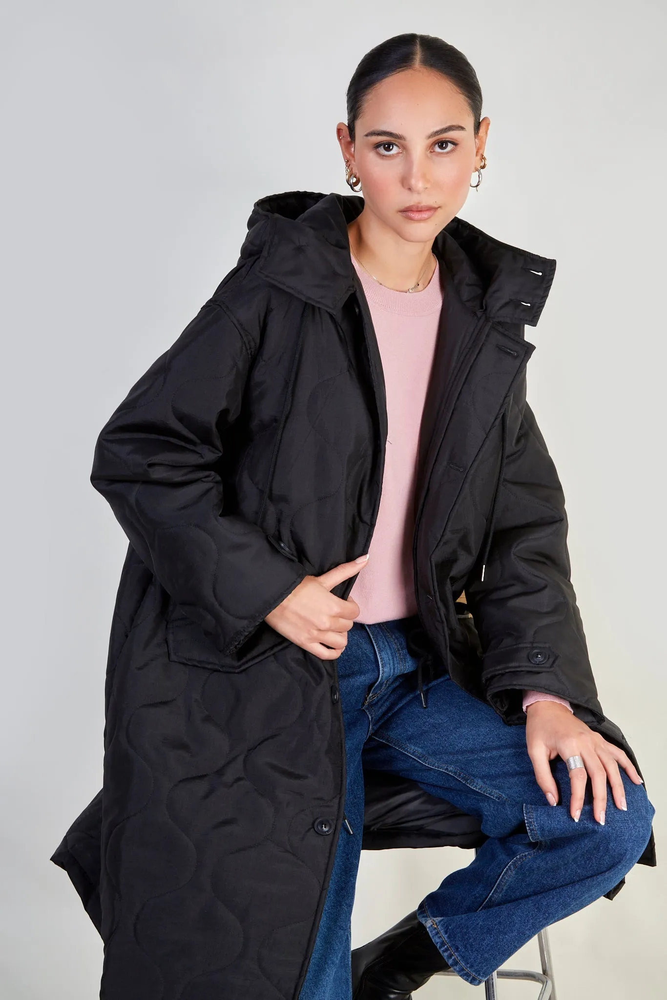 Black long rounded quilt jacket